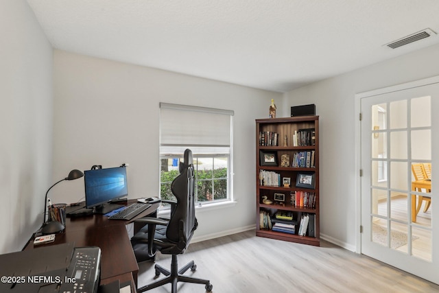 home office featuring light hardwood / wood-style flooring