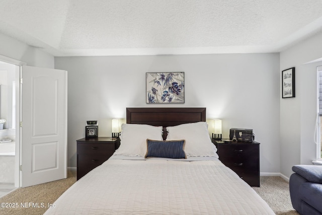 carpeted bedroom with a textured ceiling