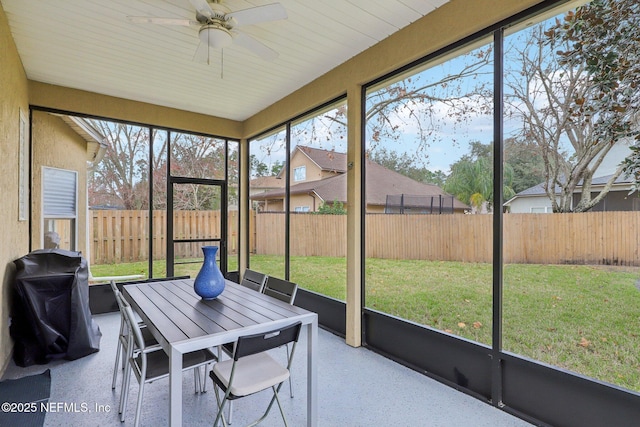 sunroom / solarium with ceiling fan