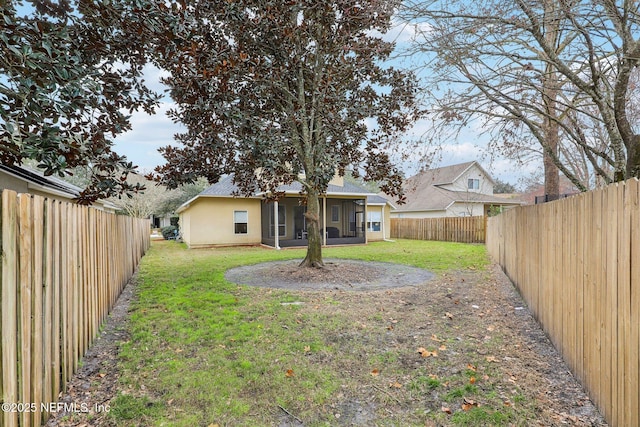 view of yard featuring a sunroom