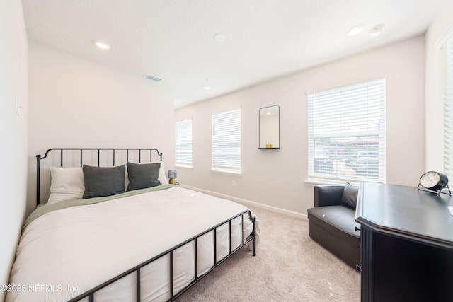 bedroom with light colored carpet