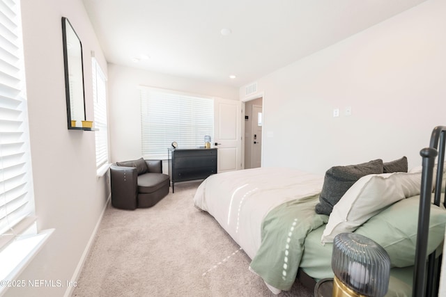 bedroom featuring light colored carpet