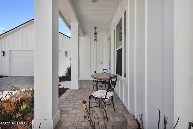 view of patio featuring a garage and covered porch