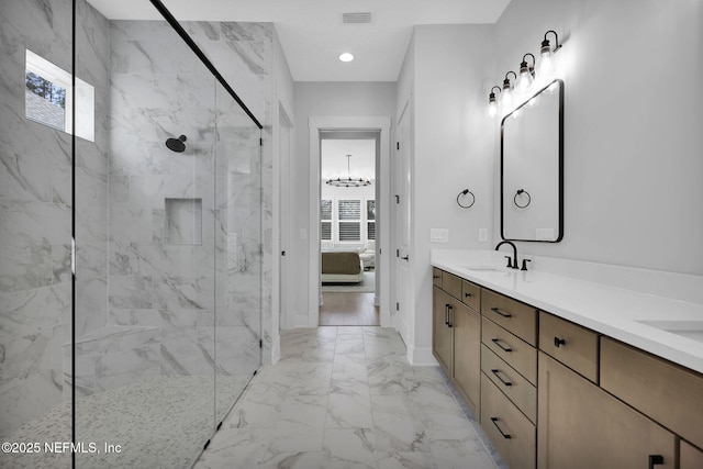 bathroom with vanity and a tile shower