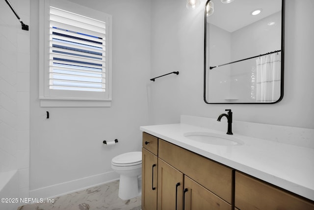 bathroom with toilet and vanity