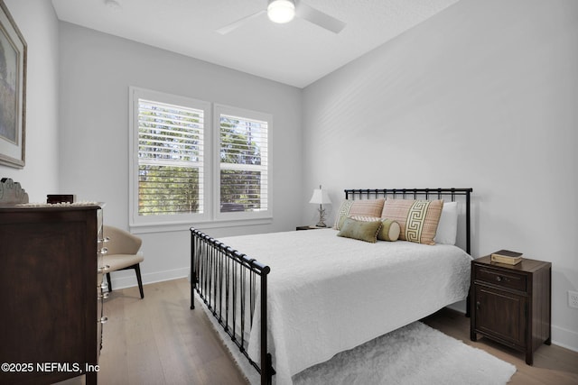 bedroom featuring ceiling fan and light wood-type flooring