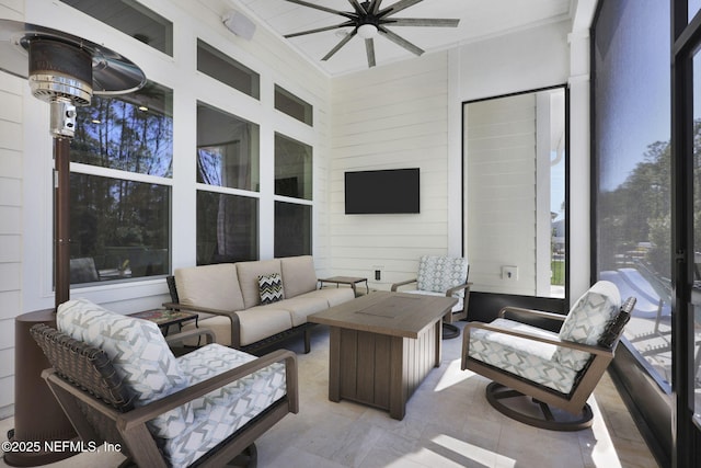 exterior space featuring ceiling fan