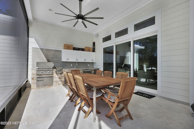 view of patio featuring sink, ceiling fan, an outdoor kitchen, and a grill