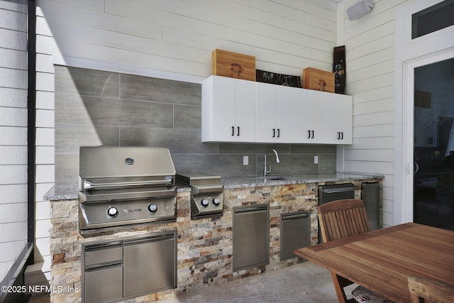 kitchen with refrigerator, exterior kitchen, and sink