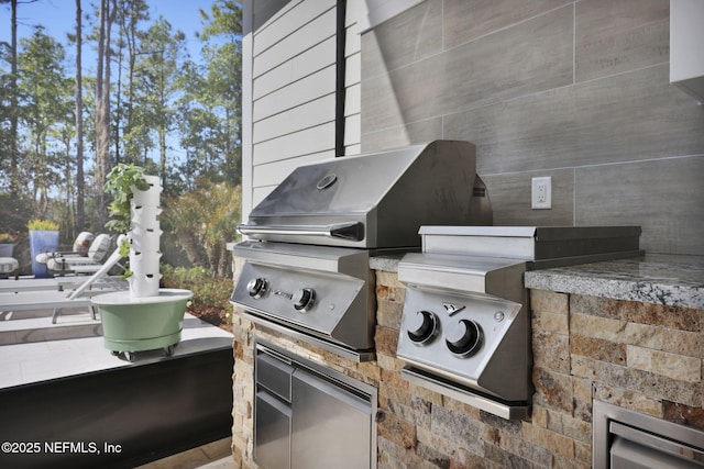 view of patio featuring exterior kitchen