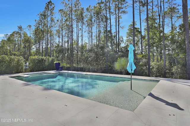 view of pool featuring an in ground hot tub and a patio area