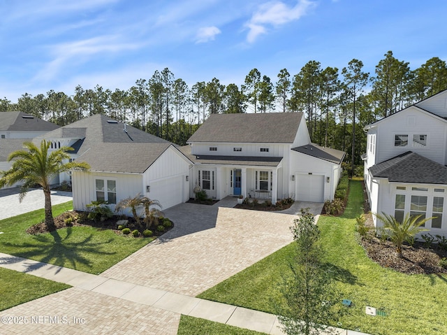 view of front facade featuring a garage and a front lawn