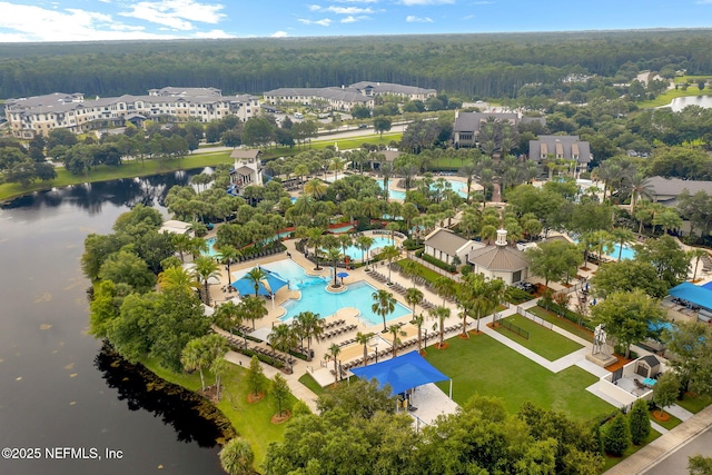 birds eye view of property with a water view