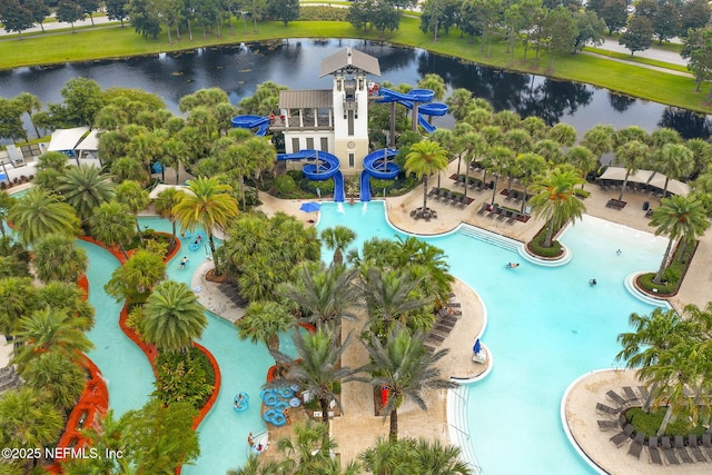 view of swimming pool featuring a water view