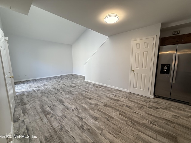 additional living space featuring light hardwood / wood-style floors