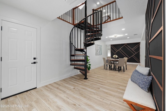 foyer entrance with light wood-type flooring