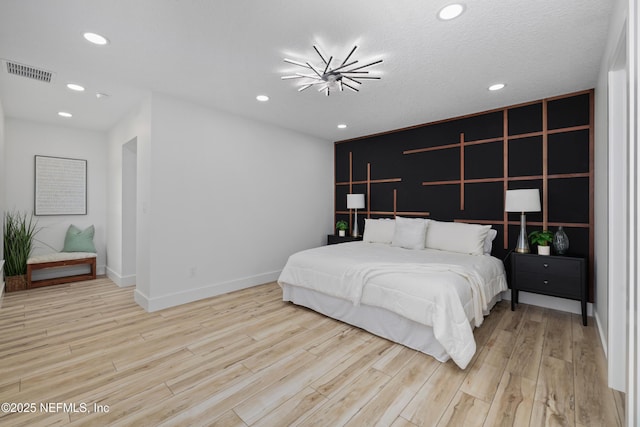 bedroom with light hardwood / wood-style flooring