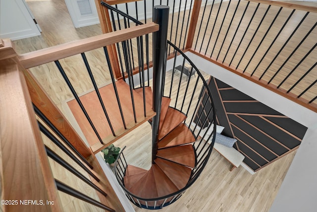 stairway featuring hardwood / wood-style floors