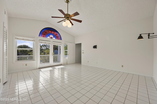 interior space with french doors, high vaulted ceiling, a textured ceiling, light tile patterned floors, and ceiling fan