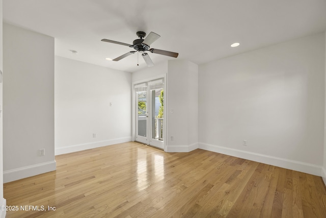 spare room featuring light hardwood / wood-style flooring and ceiling fan