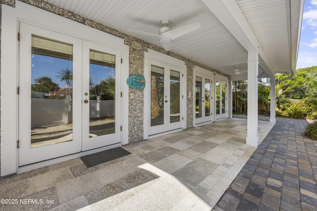 view of patio featuring french doors and ceiling fan