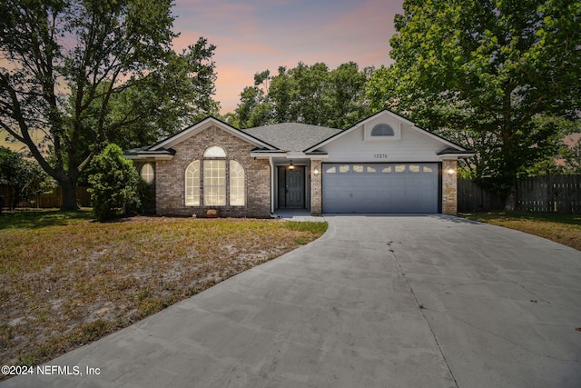 single story home featuring a garage