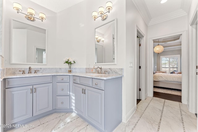 bathroom with vanity and ornamental molding