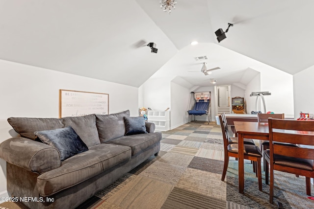 carpeted living room with lofted ceiling