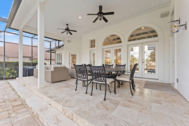 sunroom / solarium with french doors and a healthy amount of sunlight