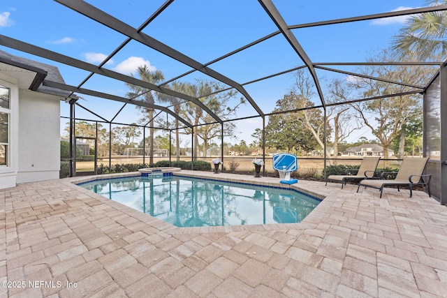 view of pool featuring an in ground hot tub, a lanai, and a patio area