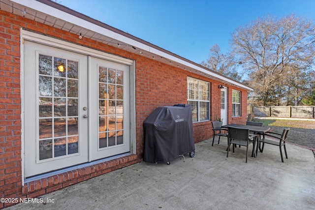 view of patio / terrace with area for grilling and french doors