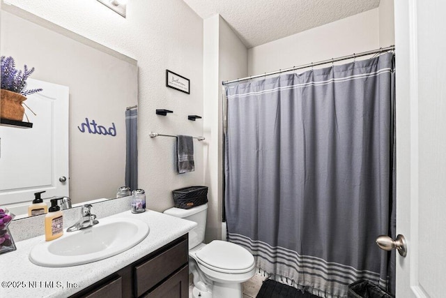 bathroom with vanity, a shower with shower curtain, a textured ceiling, and toilet