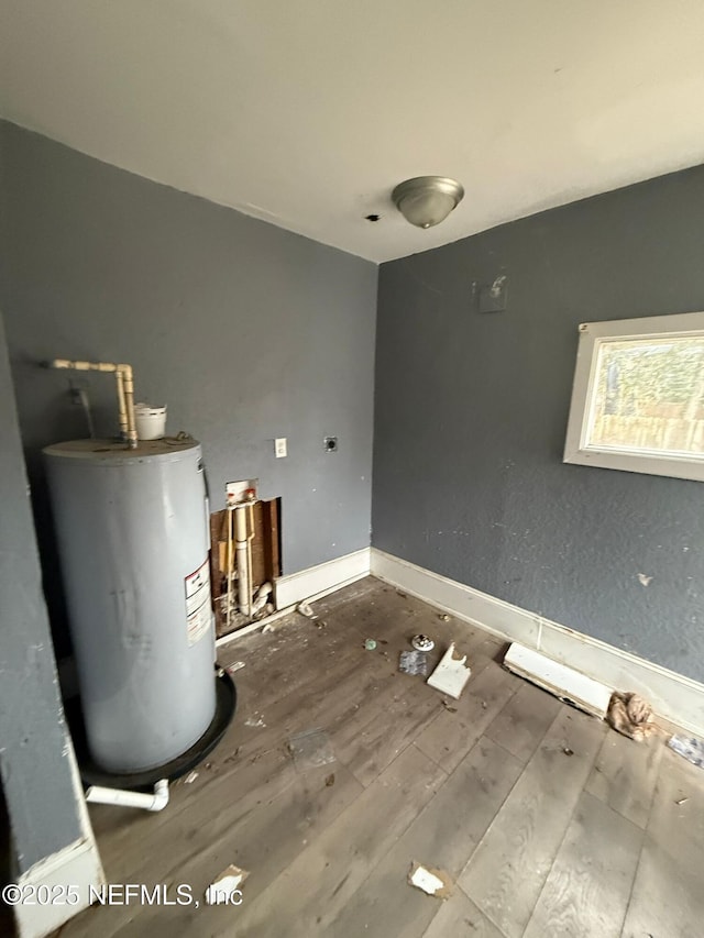 utility room with electric water heater