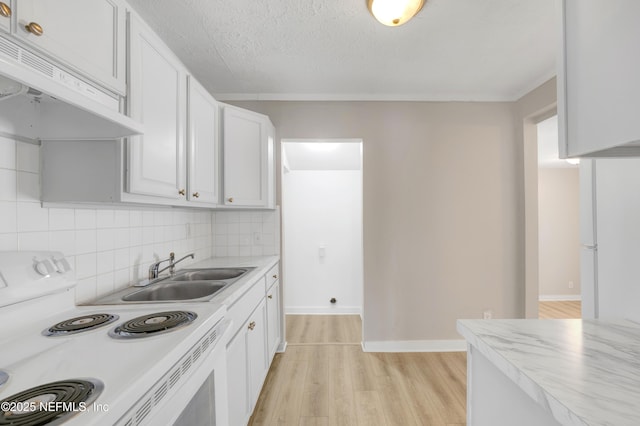 kitchen featuring sink, backsplash, white range with electric stovetop, light hardwood / wood-style floors, and white cabinets