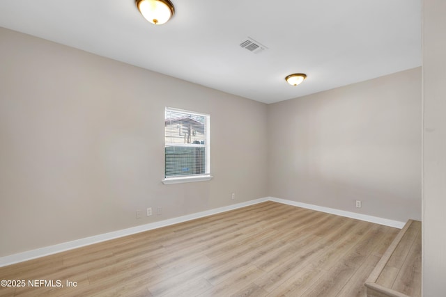 unfurnished room featuring light hardwood / wood-style flooring