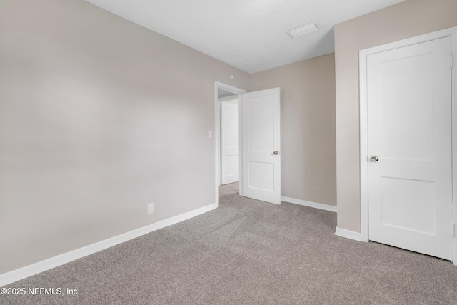 unfurnished bedroom with light carpet