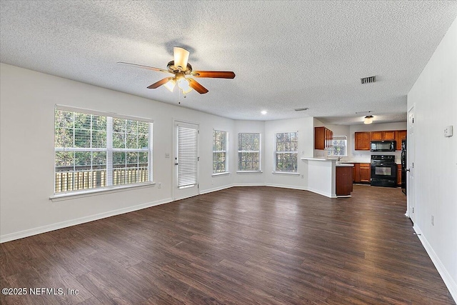 unfurnished living room featuring a textured ceiling, dark wood-type flooring, and ceiling fan