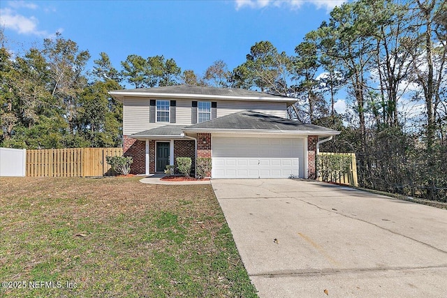 view of property with a garage and a front lawn