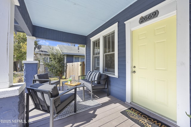 wooden terrace featuring a porch