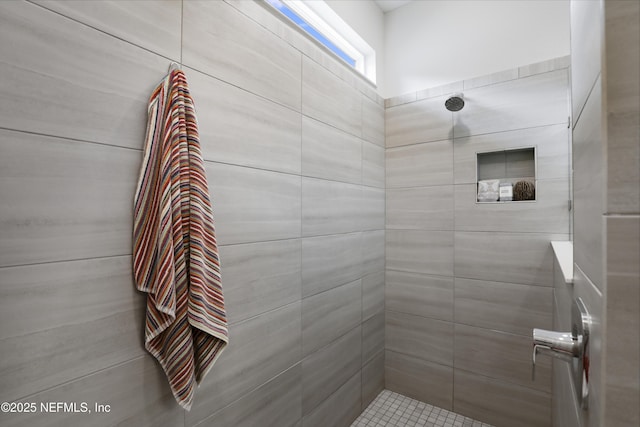 full bath featuring tiled shower