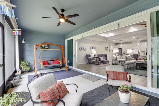 interior space featuring a sunroom, baseboards, a ceiling fan, and recessed lighting