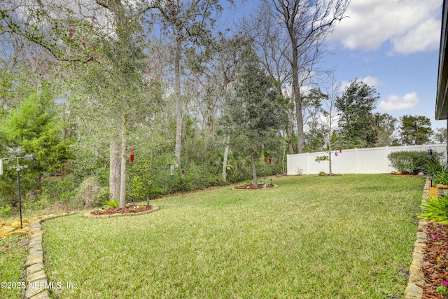 view of yard featuring fence