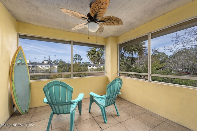 sunroom / solarium with ceiling fan