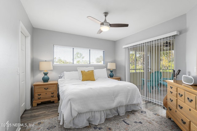 bedroom with access to exterior, dark hardwood / wood-style floors, and ceiling fan