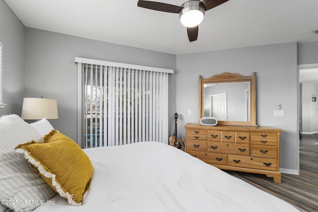 bedroom with dark wood-type flooring and ceiling fan