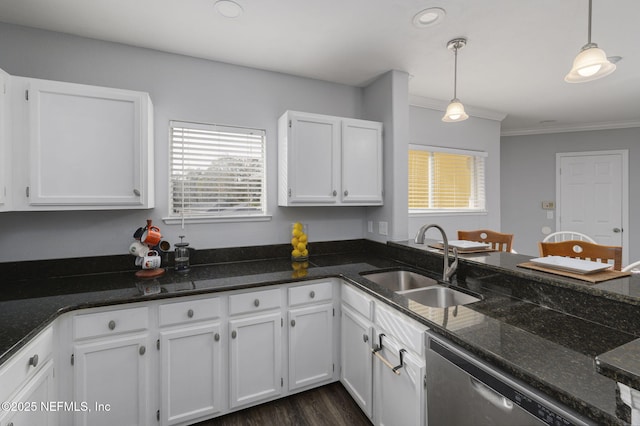 kitchen featuring hanging light fixtures, dishwasher, sink, and white cabinets