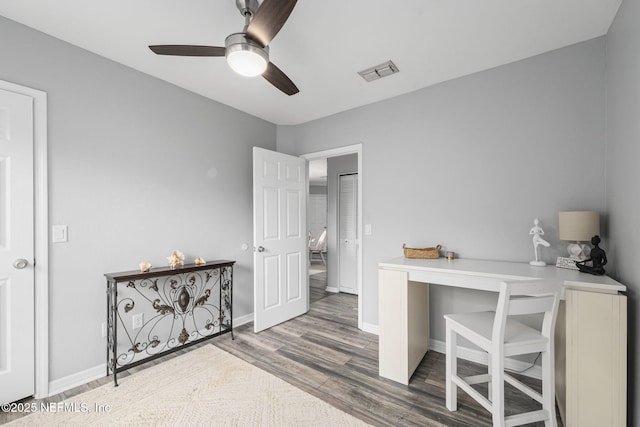 office area with ceiling fan and wood-type flooring