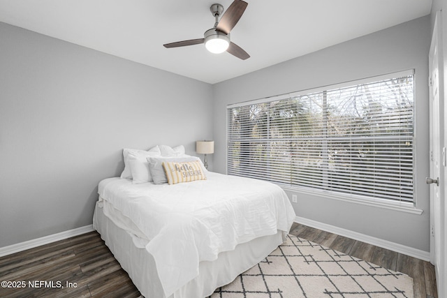 bedroom featuring ceiling fan and dark hardwood / wood-style flooring