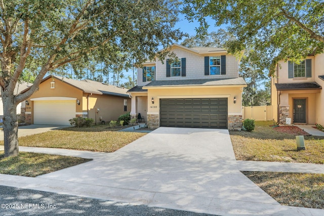 view of front facade featuring a garage and a front lawn