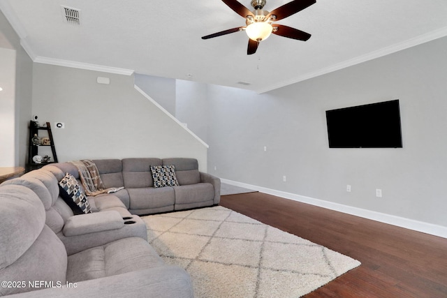 living room with crown molding, hardwood / wood-style flooring, and ceiling fan